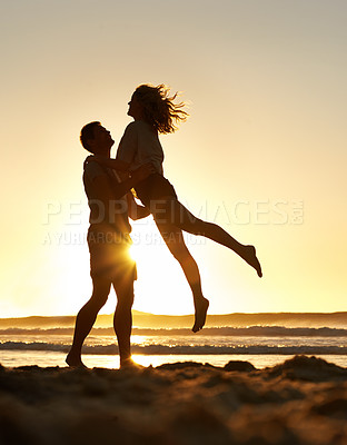 Buy stock photo Couple, love and happy at beach with sunset for date or summer holiday and bonding in Florida. Relationship, commitment and romance together as soulmate with smile, fun and lifting on vacation