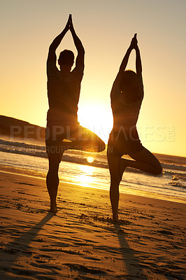 Buy stock photo Healthy couple, silhouette and yoga at sunset for wellness, meditation and peace in nature. Man, woman and exercise on beach for mindfulness, fitness and training in tropical vacation in Bali. 