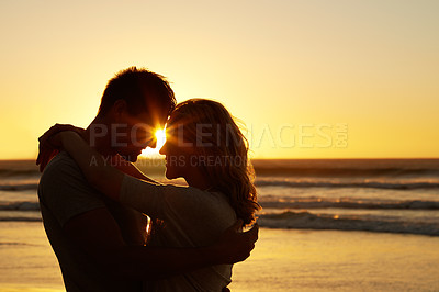 Buy stock photo Couple, love and kiss at beach with sunset for date or summer holiday and bonding in Florida. Relationship, evening and romance together as soulmate with smile, vacation and happy with forehead touch