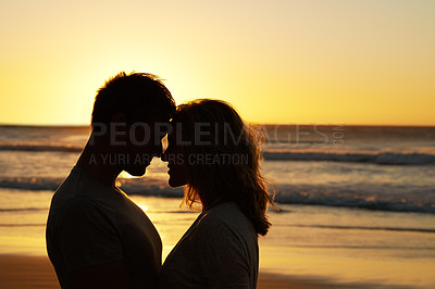 Buy stock photo Couple, love and kiss at ocean with silhouette for date or summer holiday and bonding in Florida. Relationship, commitment and romance together as soulmate with smile, happy and vacation or honeymoon