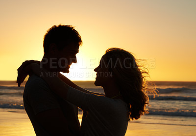 Buy stock photo Couple, love and smile at beach with sunset for date or summer holiday and bonding in Florida. Relationship, silhouette and romance together as soulmate with travel, hug and vacation for honeymoon