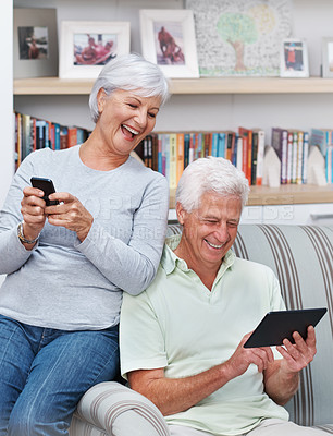 Buy stock photo Senior couple, tablet and laugh for joke in home, comedy and streaming comic on social media. Elderly people, funny internet blog and relax on couch, bonding and happy in retirement for online love
