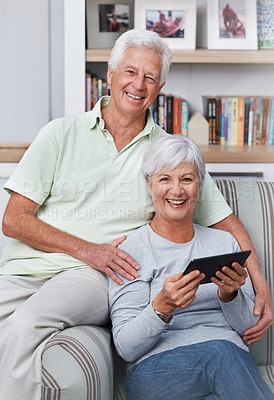 Buy stock photo Portrait, senior couple and smile with tablet, sofa and home for social media, online news app and ebook. Happy old man, woman and digital technology for subscription, website and internet connection