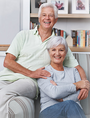 Buy stock photo Senior couple, portrait and smile in living room for love, care and quality time together at home. Face of happy elderly man, old woman and enjoy retirement, support and relax in relationship 