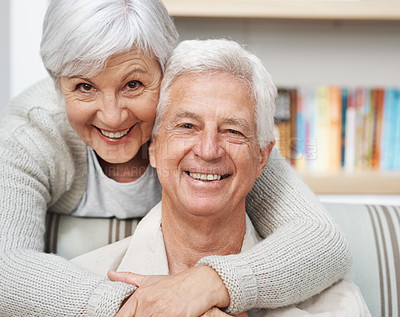 Buy stock photo Senior, happy couple and portrait with hug for love, romance or embrace in relationship or marriage at home. Face of elderly woman hugging man with smile for care or bonding together in retirement