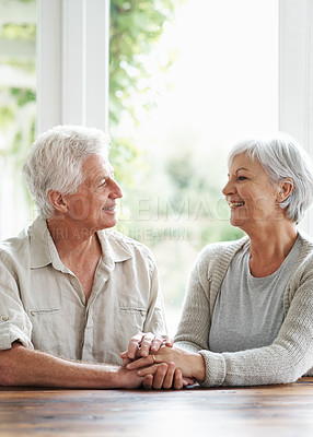 Buy stock photo Happy senior couple holding hands in support, love and comfort together in retirement at home. Elderly man, old woman and smile with helping hand, trust and care for life partner, loyalty and respect