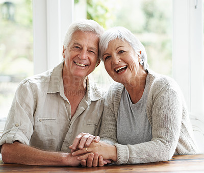 Buy stock photo Portrait, laughing and senior couple holding hands for love, care and relax together at home. Face of happy old man, woman and helping hand for trust, support and loyalty to partner in retirement