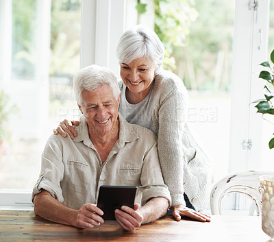 Buy stock photo Tablet, happy old couple and online in home with social media, reading news app and ebook. Retirement, senior man and woman with digital technology for subscription, streaming and network connection