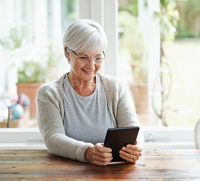 Buy stock photo Tablet, senior woman and online in house with social media, reading news app and relax with ebook. Retirement, happy old lady and digital technology for subscription, streaming and network connection