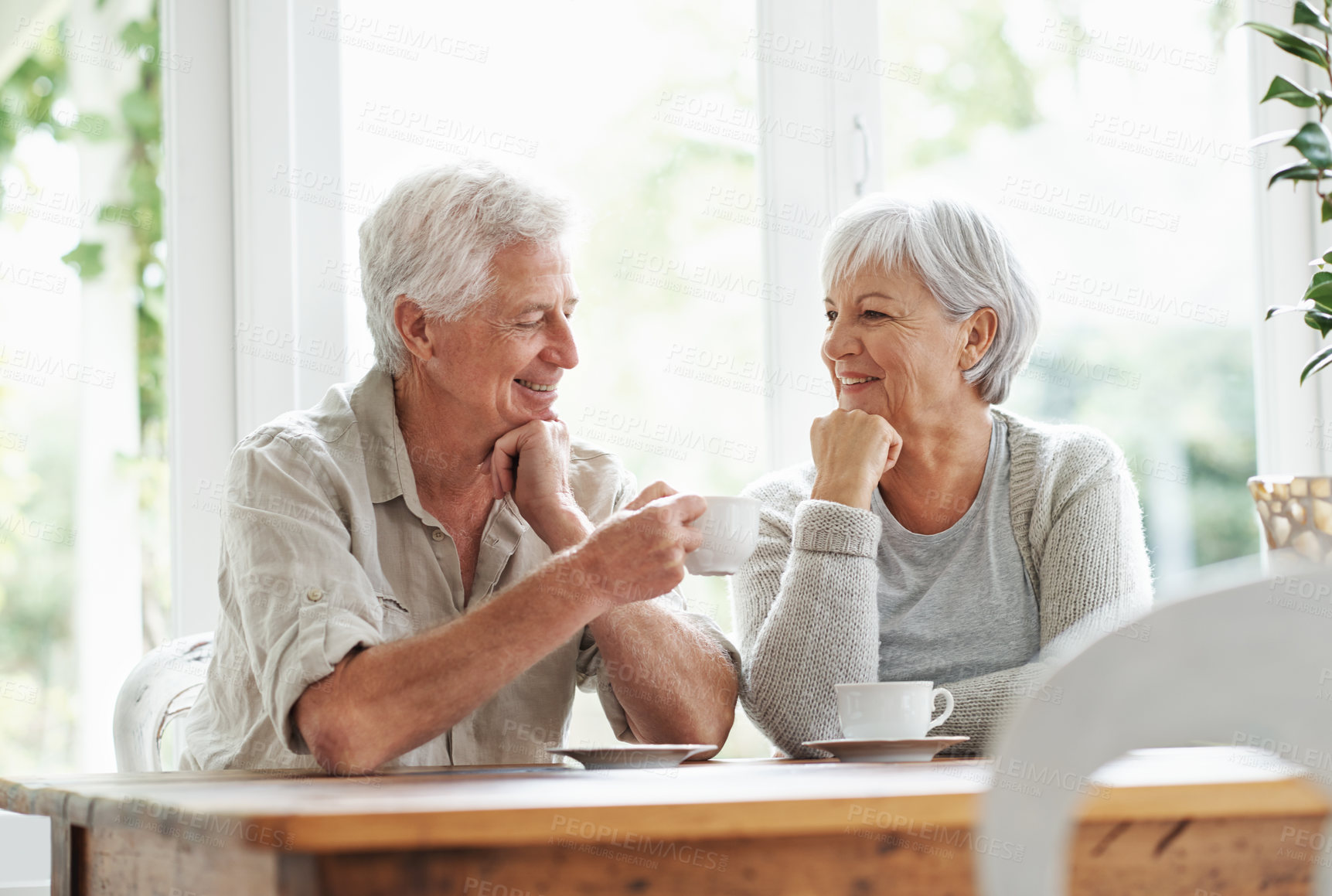 Buy stock photo A senior couple enjoying a cup of tea together