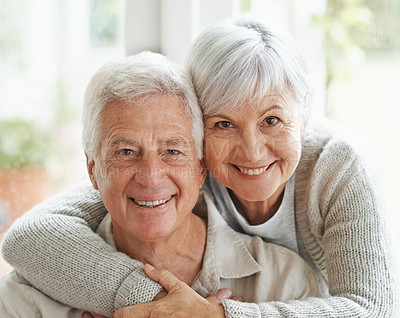 Buy stock photo A loving senior couple smiling at the camera