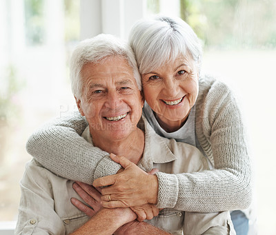 Buy stock photo Portrait, smile and senior couple with love, hug and romance with retirement, relationship and bonding. Face, happy mature woman and elderly man embrace, home and marriage with commitment and loving