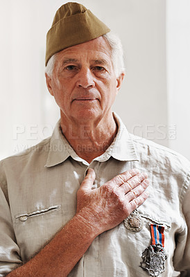 Buy stock photo Senior person, army and veteran in portrait for memories, pride and respect in home for remembering. Mature man, war and hero in retirement with service, medals and uniform as soldier or patriot