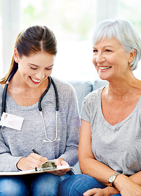 Buy stock photo Results, consultation and senior woman with doctor in home to check health with advice and support. Healthy, patient and therapist in elderly care with info or notes o, hypertension or blood pressure