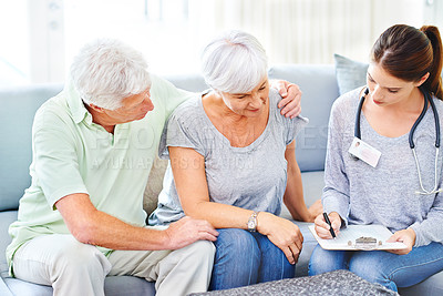 Buy stock photo Senior, couple and doctor with results for woman in consultation with advice and support. Patient, report and nurse in elderly care with news, info or medical notes on hypertension or blood pressure