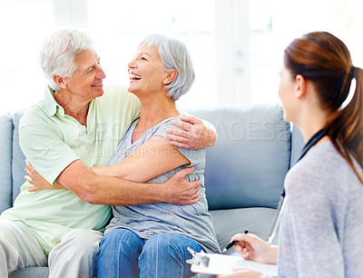 Buy stock photo Senior couple, happy and embrace on couch in nursing home with good news, doctor or positive results. Old partners, hug or laugh with nurse or carer in retirement centre for diagnosis, test or health