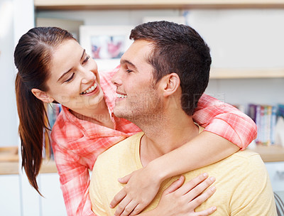 Buy stock photo Happy couple, hug and home with love for embrace, support or care in relationship or romance. Young man, woman or lovers with smile for affection, bonding or weekend together in living room at house