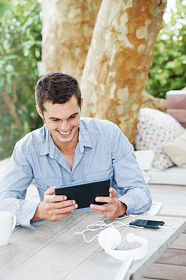 Buy stock photo Internet, smile and man with tablet on patio for networking, communication and social media. Happy, male person and  desk with technology in garden for online search, digital streaming or information