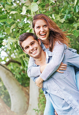 Buy stock photo Happy, portrait and couple piggyback outdoor on date in garden, park or adventure on holiday or vacation. People, relax and play a game in backyard or fun partner support woman with ride on back
