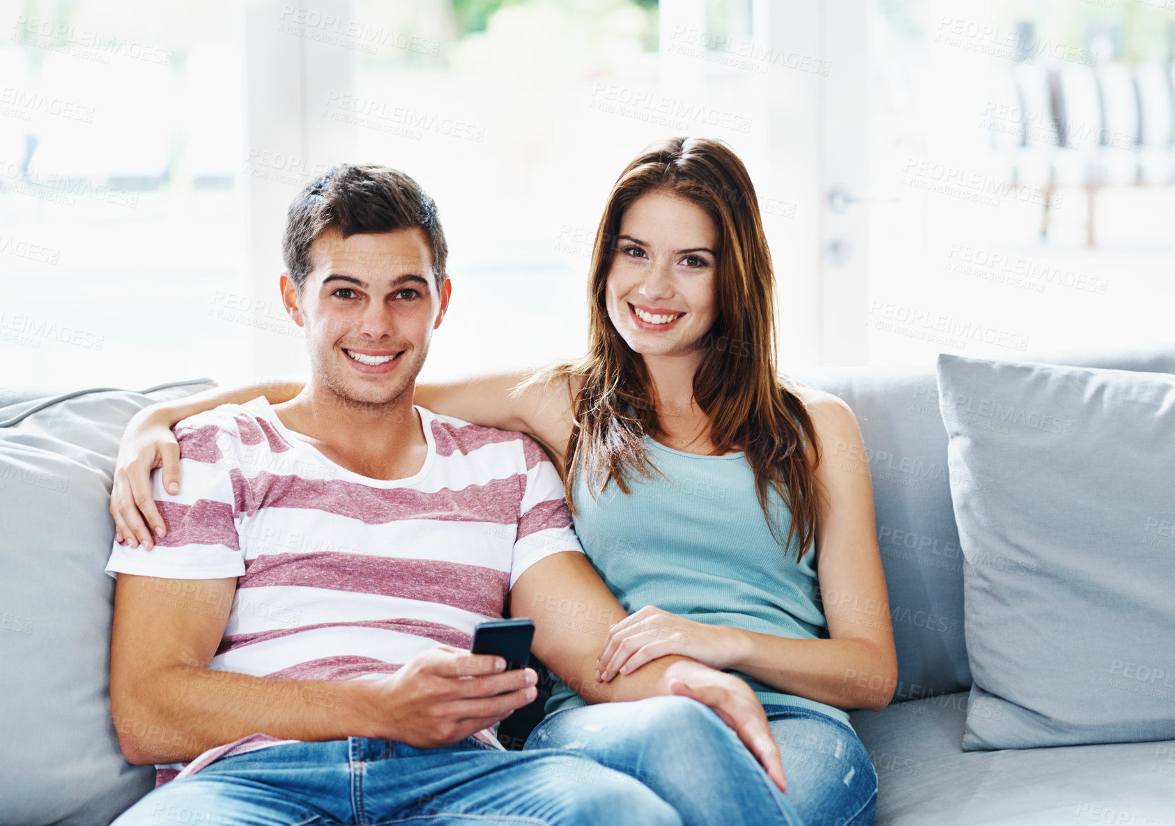 Buy stock photo Portrait couple, living room and relax on sofa for bonding, smile and hug in new apartment for support. Home, happy and commitment for marriage, romantic and relationship for security with love