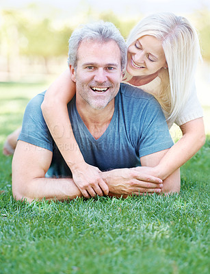 Buy stock photo Happy, park and portrait of senior couple for bonding, relationship and commitment outdoors on grass. Love, retirement and mature man and woman embrace for romance, relax and marriage in nature