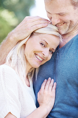 Buy stock photo Happy, hug and portrait of mature couple in park for bonding, relationship and commitment on weekend. Love, retirement and senior man and woman embrace for romance, relaxing and marriage in nature