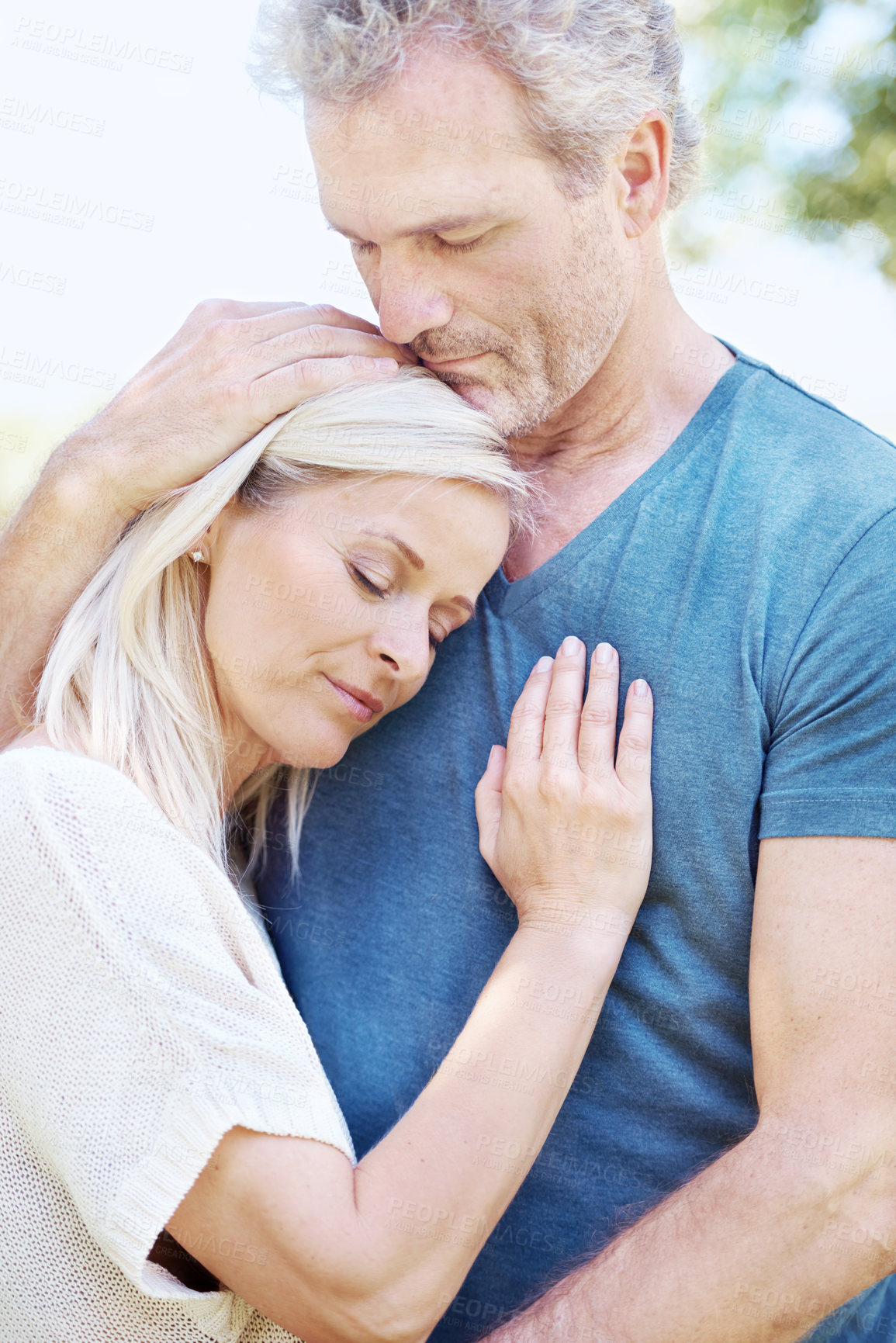 Buy stock photo Love, hug and mature couple in park for bonding, relationship and commitment outdoors on weekend. Devotion, retirement and senior man and woman embrace for romance, relaxing and marriage in nature