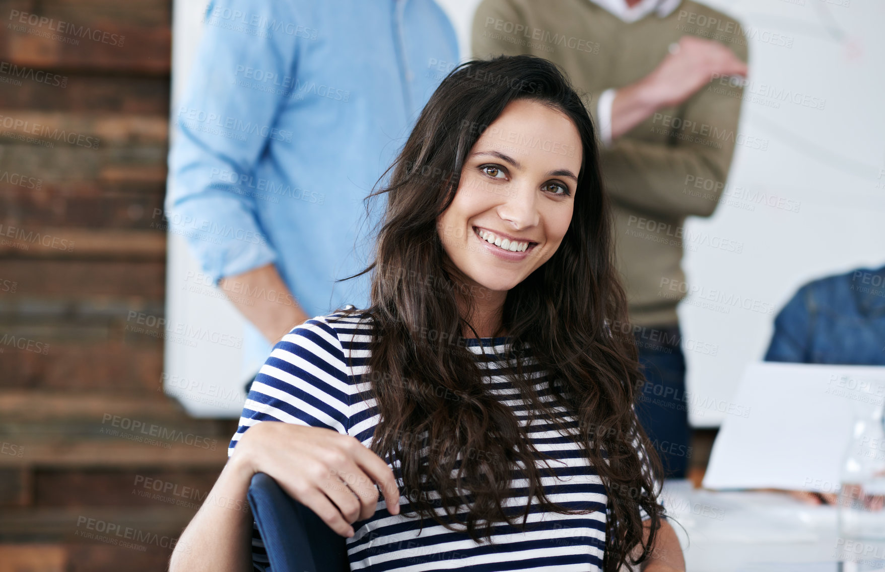 Buy stock photo Portrait, meeting and woman with smile, desk and creative with group, teamwork and planning for project. Design, agency and employee with happiness, leader and table for work, together and office