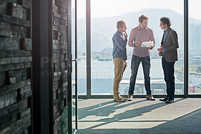 Buy stock photo Business people, men and collaboration with document for planning by window of office for b2b brainstorming. Partnership, employees or discussion with paperwork for financial review or project report