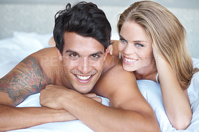 Buy stock photo Couple, relax and portrait in bed on morning, love and romance bonding in home for relationship. Happy people, touch and security in marriage connection, care and rest in hotel and bedroom for smile