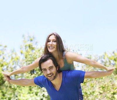 Buy stock photo Couple, piggy back and outside together for relationship, bonding love and care in nature date for romance. Blue sky, trees and summer holiday with airplane game for travel adventure in sunshine