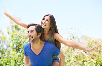 Buy stock photo Couple, piggy back and nature together for relationship, bonding love and care in outside date for romance. Blue sky, trees and summer holiday with airplane game, travel and adventure in sunshine