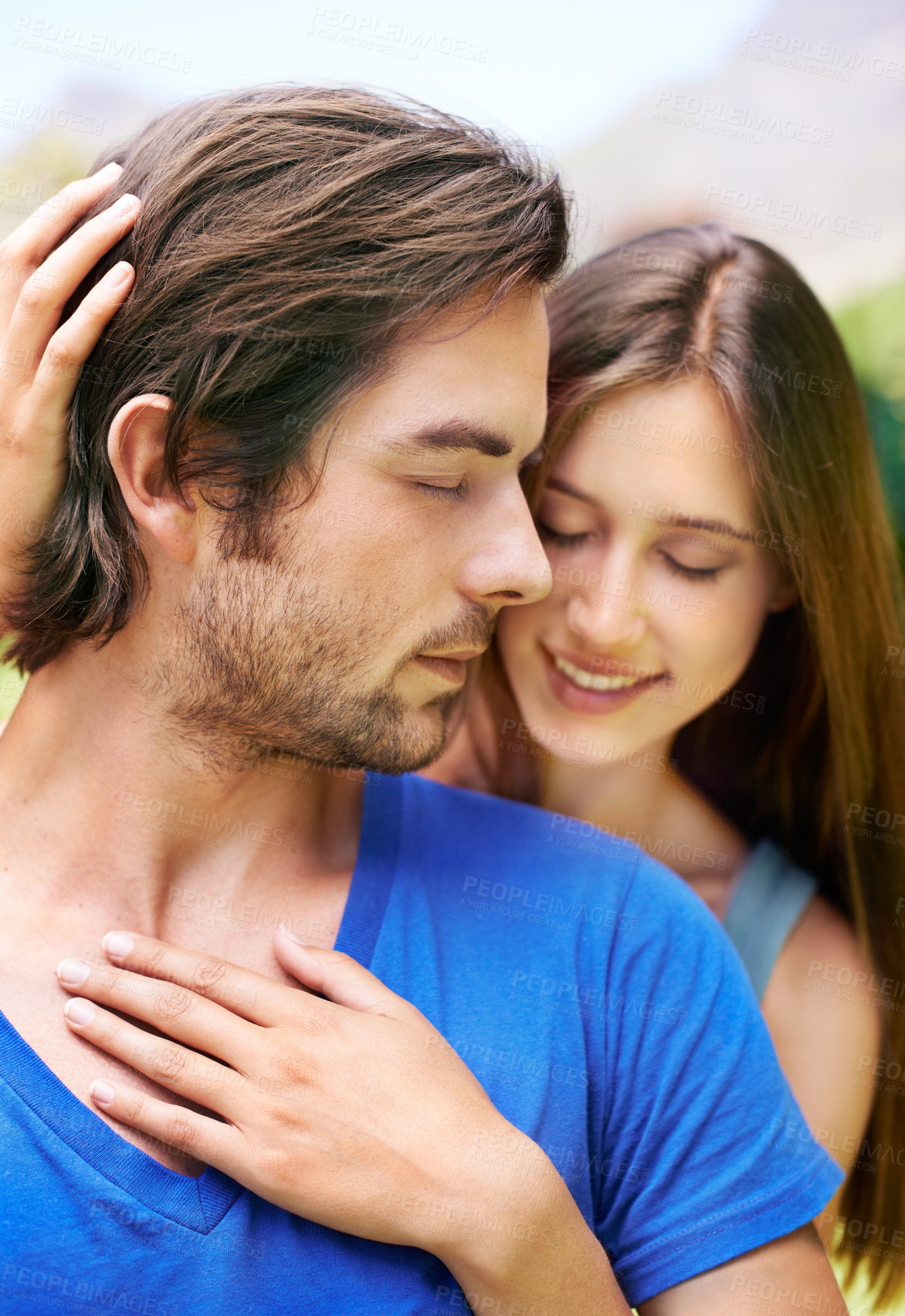 Buy stock photo Couple, back hug and love outdoor with affection for relationship, date and time together in summer. Man, woman and embrace with happiness and smile in garden for connection, care and commitment