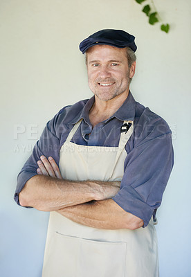 Buy stock photo Portrait of a hansome mature man in an apron