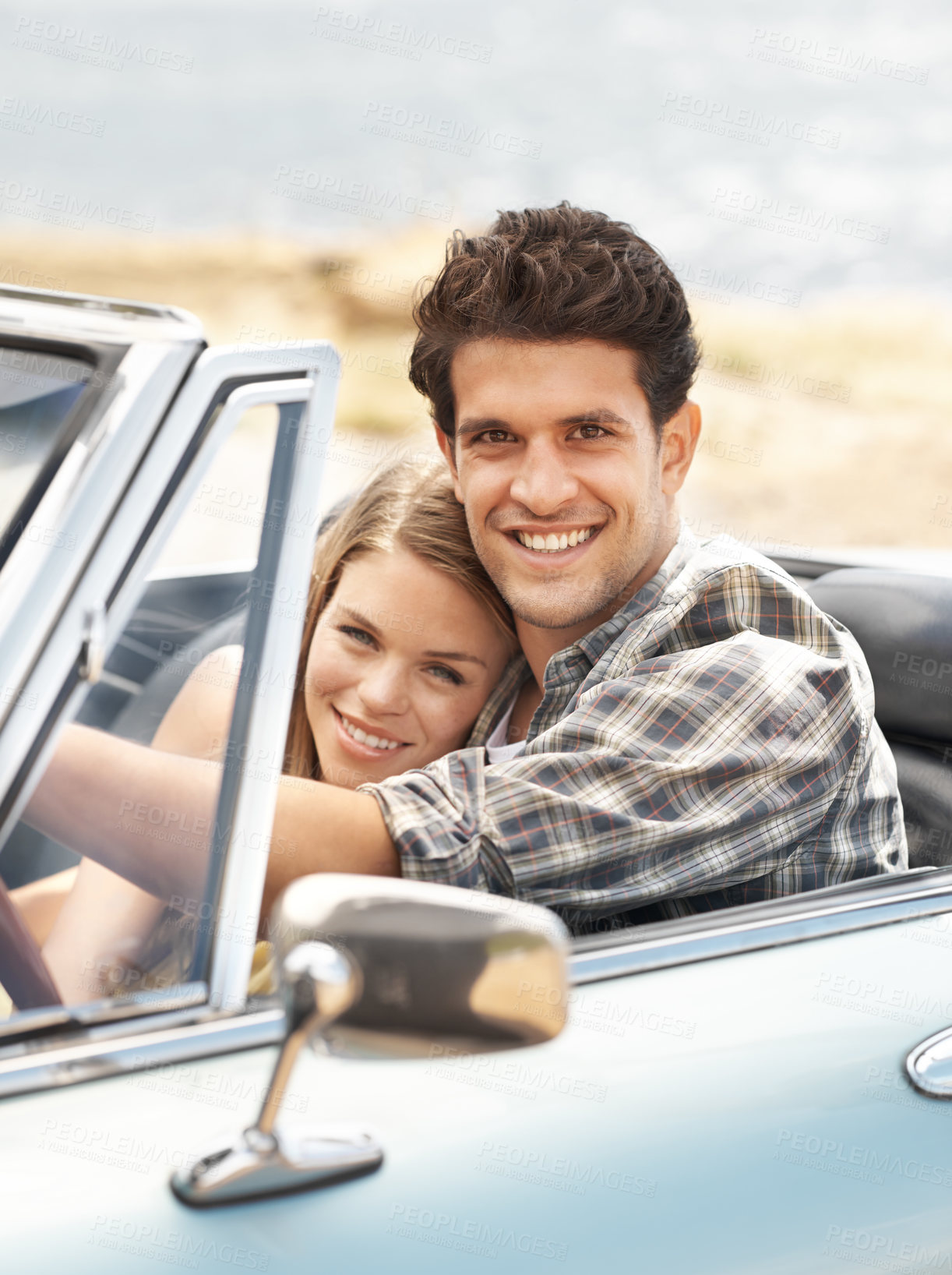 Buy stock photo Portrait, travel and couple in convertible car for road trip with hug, holiday journey and honeymoon for happy marriage. Embrace, man and woman in motor for vacation together and love relationship