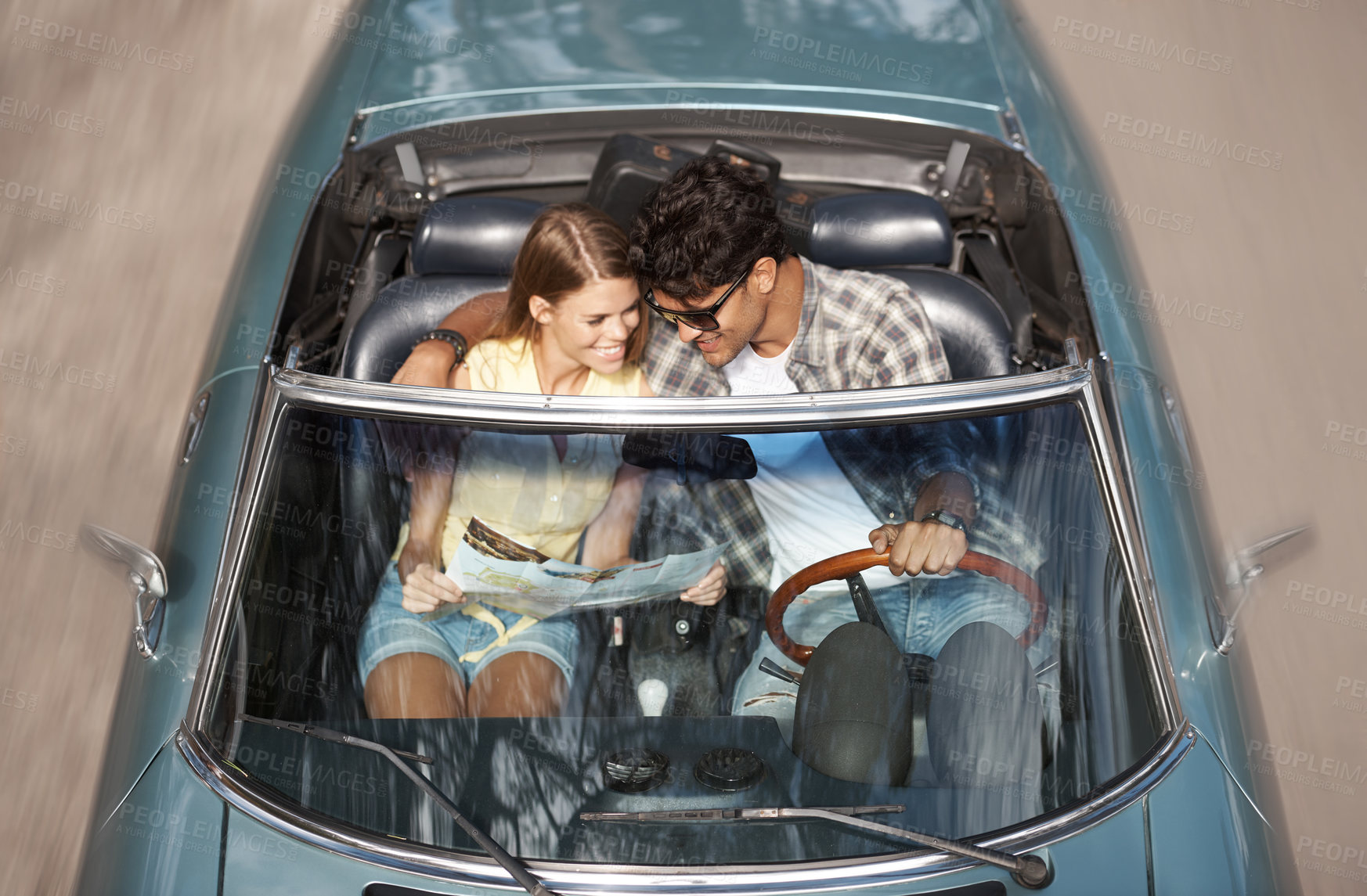 Buy stock photo Couple, driving and road trip in sports car with map on holiday or above travel on highway for vacation. Luxury, transport or people hug in convertible on journey in summer with direction on paper