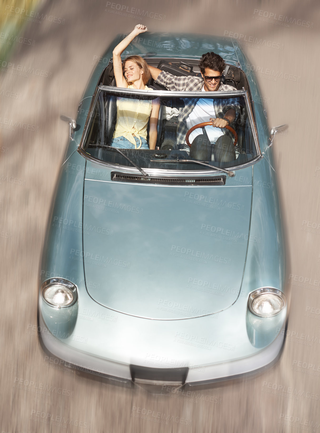 Buy stock photo Driving, top view and couple in convertible car for travel with speed, holiday journey and honeymoon for happy marriage. Movement, man and woman in motor for vacation adventure and romantic road trip
