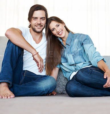 Buy stock photo Couple, apartment and relax in portrait with new home together in marriage with happiness. Smile, man and woman on sofa in house with pride for investment in real estate, property or love for partner