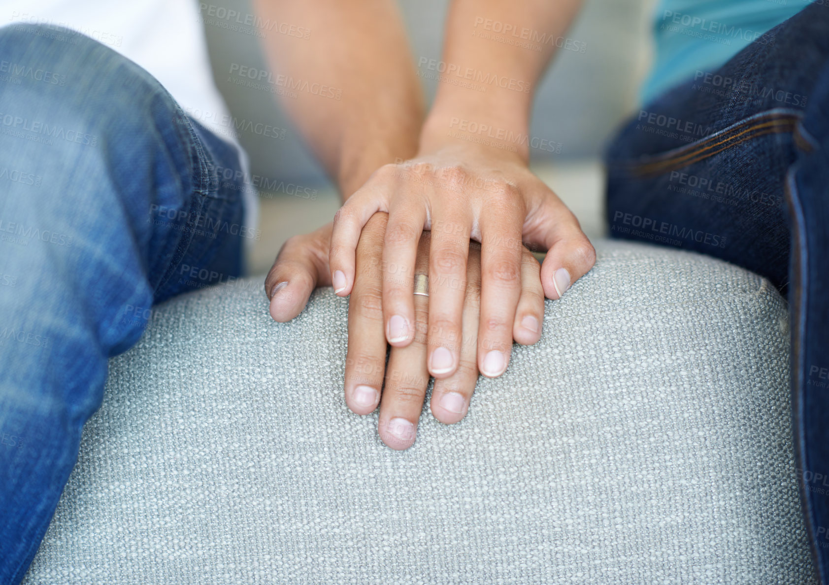 Buy stock photo Couple, love and holding hands for trust, care and solidarity or romance on couch for relax. Compassion, partnership and support for counselling, married people and therapy with affection on sofa