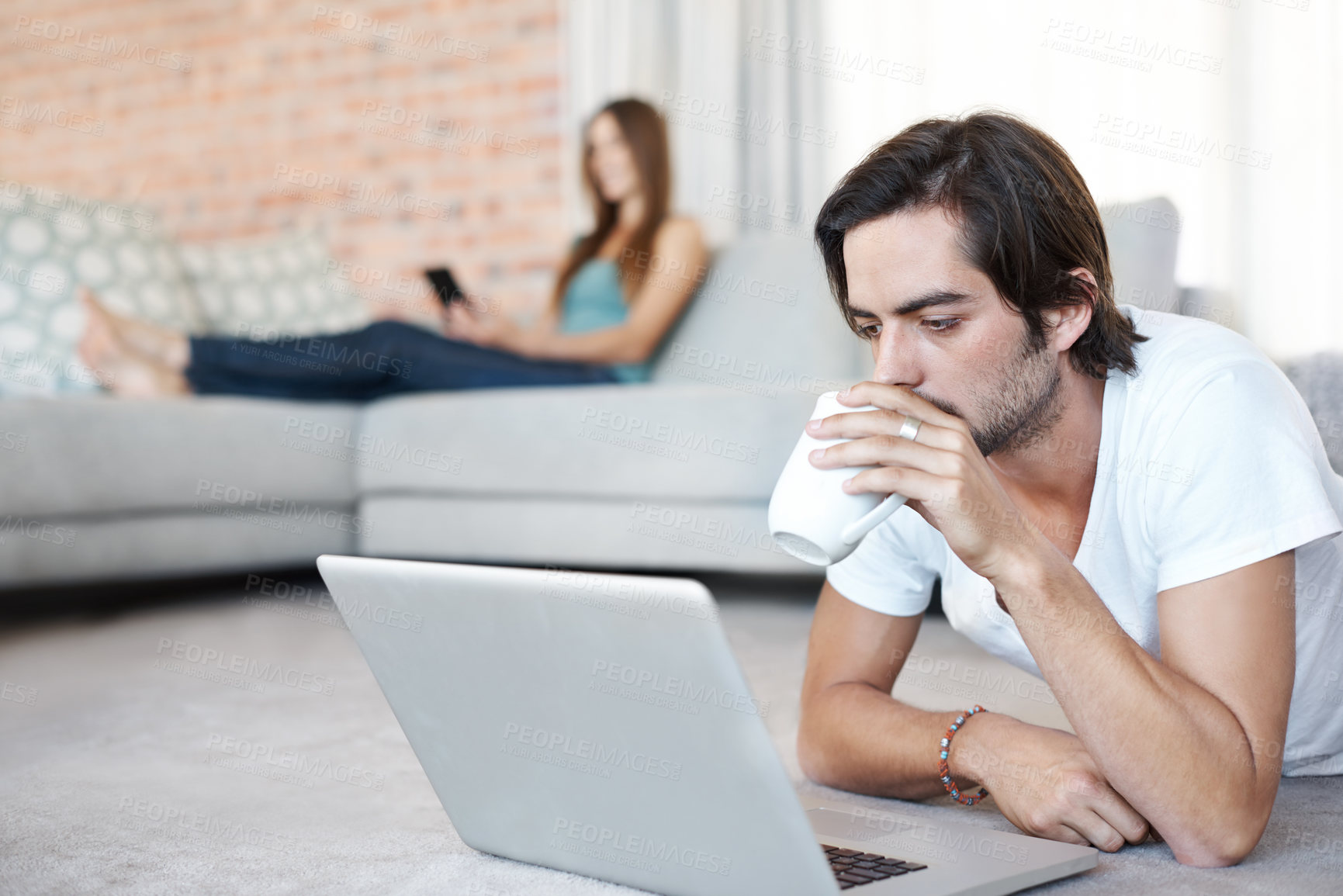 Buy stock photo Man, relax and streaming on laptop in home with coffee, espresso or watch video online on floor. Drink, tea and person on computer reading news, info or ebook on website on holiday or vacation