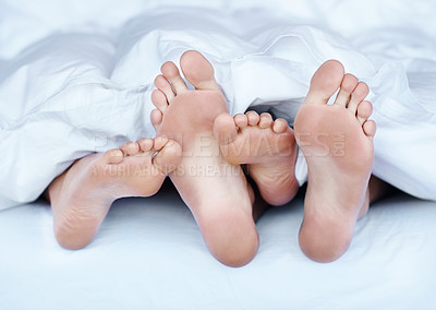 Buy stock photo Couple, feet and sleeping in bed at home for peace, relax and resting together in weekend. House, bedroom and foot of people while bonding, loving and comfortable with love or trust in morning