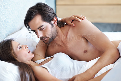 Buy stock photo Bedroom, love and couple hug together for romance, connection or bonding in morning home to relax. Man, woman and embrace in bed for care, support and conversation for healthy intimate relationship