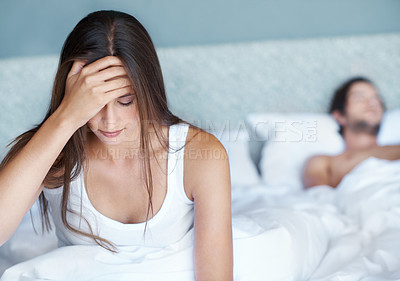 Buy stock photo Woman, frustrated and headache in bedroom with partner in burnout or exhausted with fatigue in home. Female person, tired and hand on head in stress, medical condition or upset in relationship
