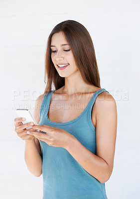 Buy stock photo Woman, phone and social media in studio for internet, texting and search against white background. Girl, smartphone and online chatting, browsing and app, online dating and networking while isolated