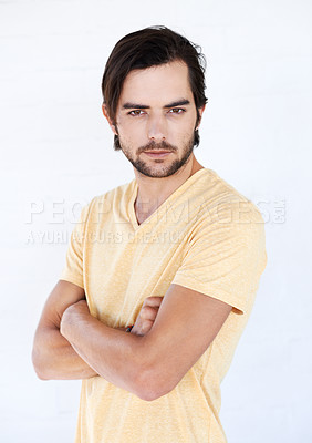 Buy stock photo Man, studio portrait and arms folded for confidence, focus or vision with t-shirt by white background. Isolated casual model, handsome male and motivation in trendy fashion, relax lifestyle or beauty