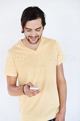 Buy stock photo Phone, communication and man on technology typing a cellphone text with isolated white background. Mobile conversation, model and smile of a person with a mobile phone texting with technology