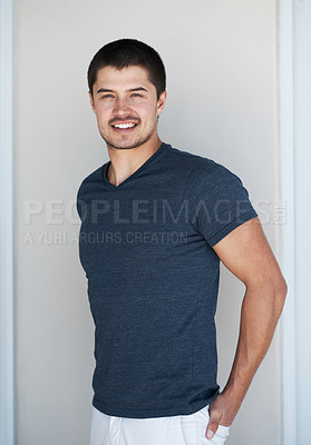 Buy stock photo Man, portrait and fashion or style in home, casual outfit and confident in designer t shirt. Male person, proud and trend on weekend in apartment, clothes and university student for cool attitude