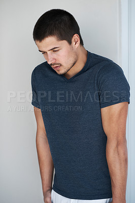 Buy stock photo Handsome young man standing against a grey background