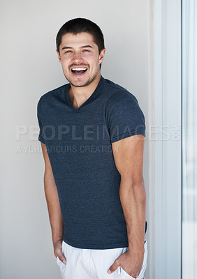 Buy stock photo Handsome young man standing against a grey background with a smile