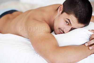 Buy stock photo Handsome young man lying in his bed while shirtless